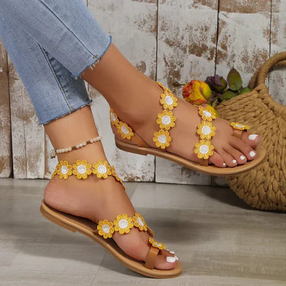 Sandalias planas con decoración floral